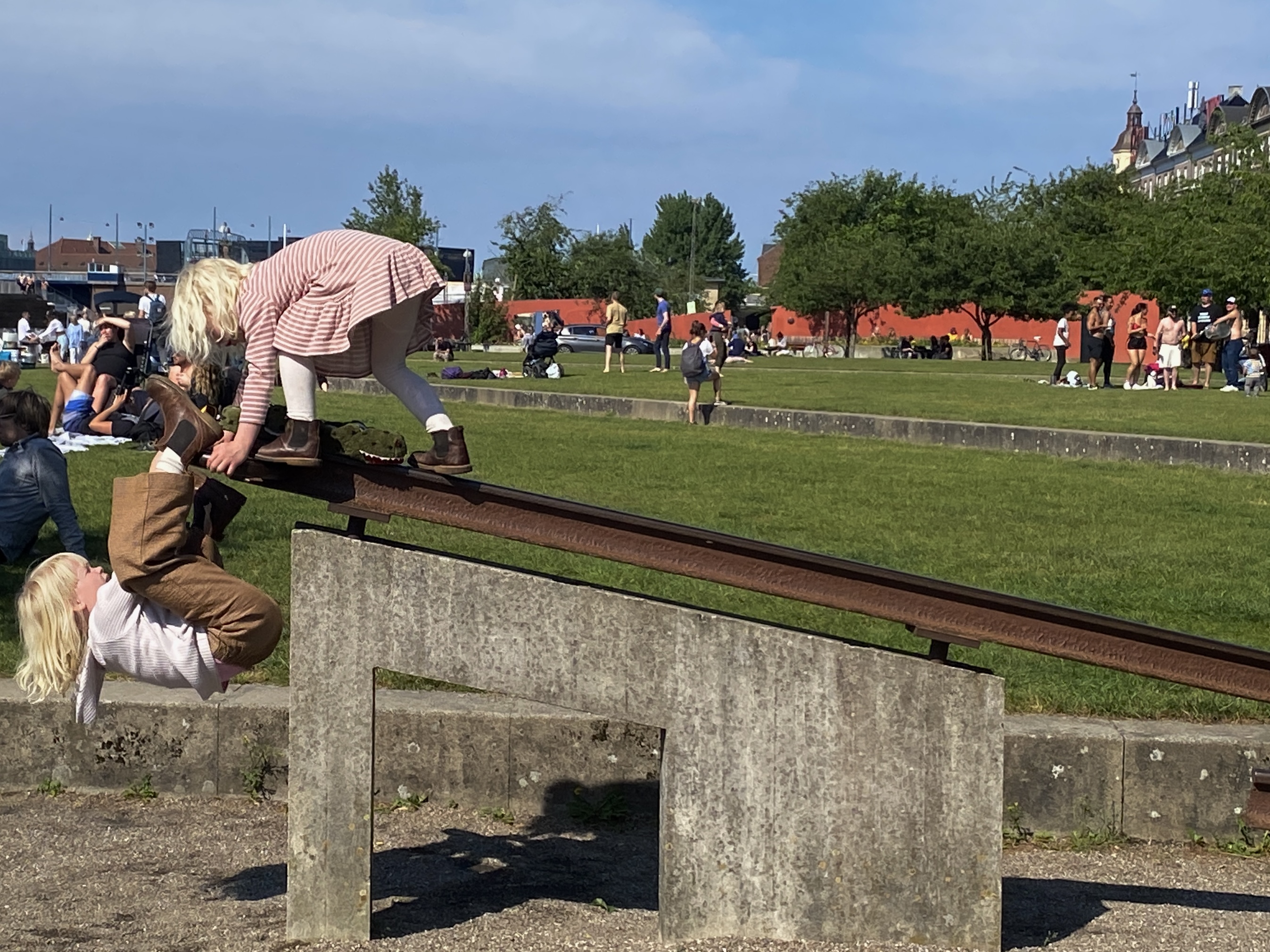 People balancing and playing in a public park